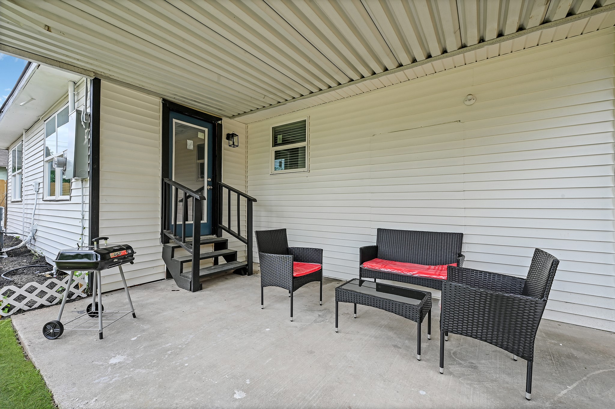 4406 Edison Street Houston, TX 77009 - Photo 40 of 42 a backyard of a house with outdoor seating