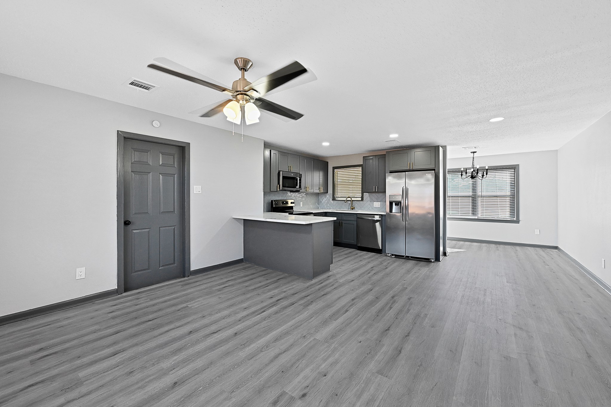 4406 Edison Street Houston, TX 77009 - Photo 4 of 42 a view of a kitchen with a sink and wooden cabinet