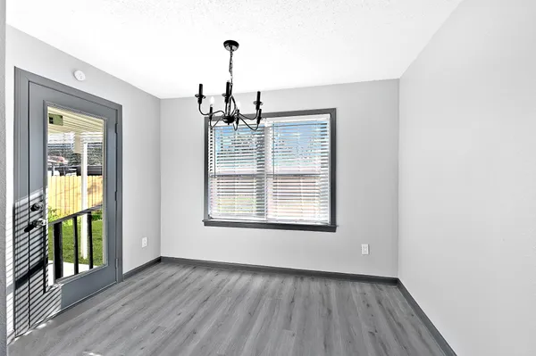 a view of an empty room with glass door