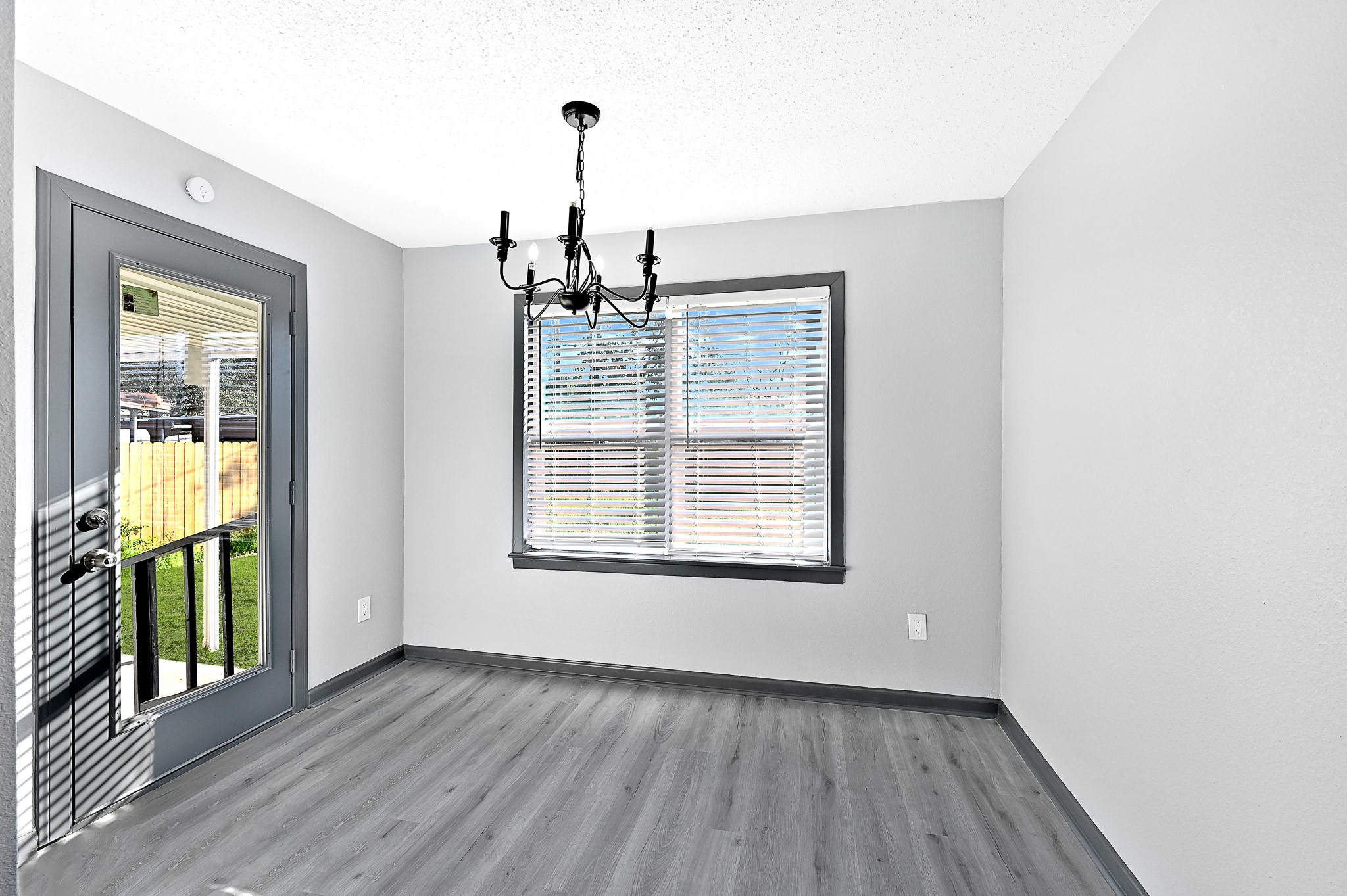 4406 Edison Street Houston, TX 77009 - Photo 8 of 42 a view of an empty room with glass door