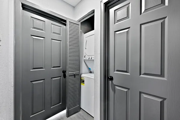 a view of a door and a window of the house