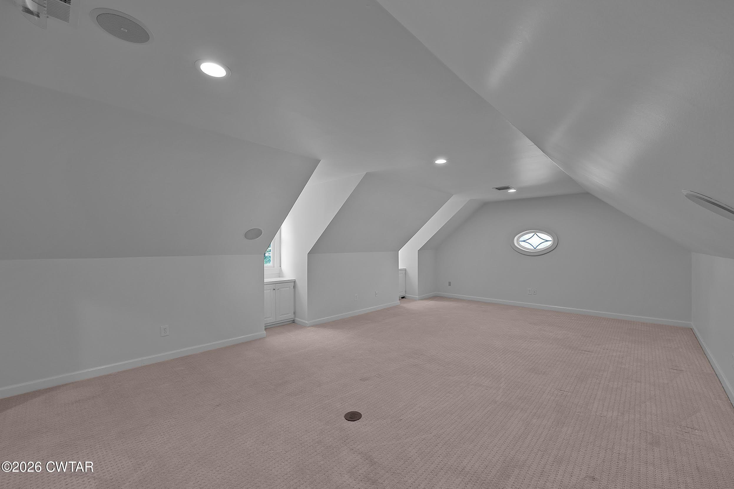 58 Huntington Place Jackson, TN 38305 - Photo 27 of 38 an empty room with stairs and white walls