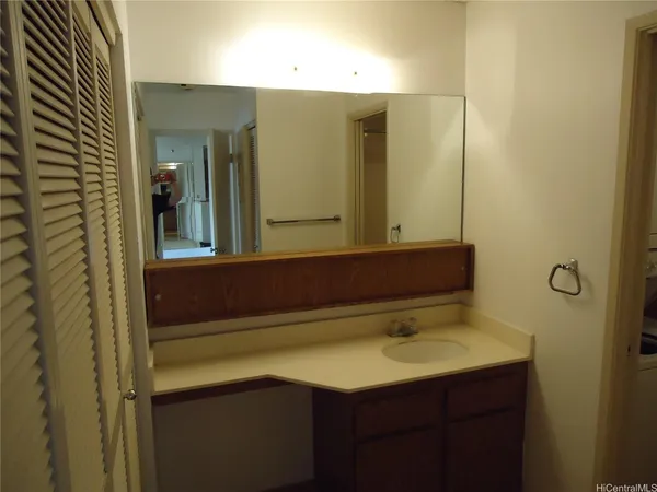 a bathroom with a sink and a mirror