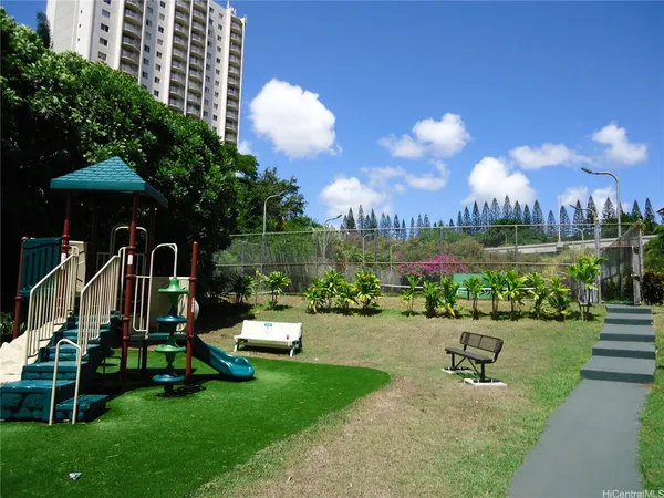 a view of a park with large trees