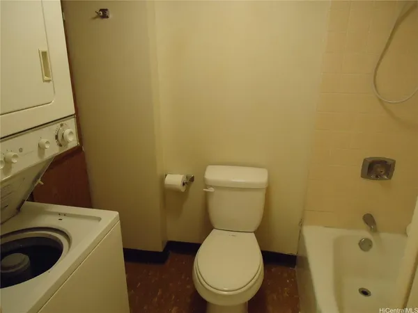 a bathroom with a toilet and a sink