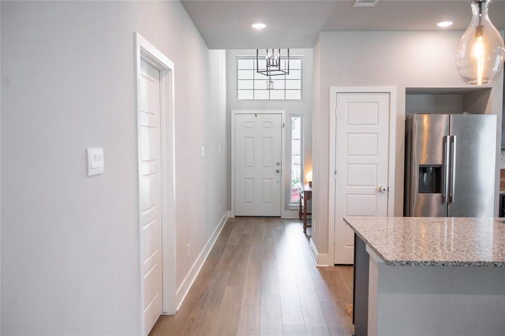 7909 Townsend Drive Waco, TX 76708 - Photo 5 of 22 Foyer featuring wood-finish flooring, recessed lighting, and a prominent front door with transom windows