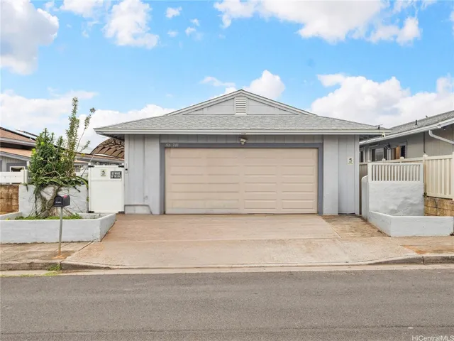 a front view of a house with a garage