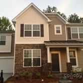 a view of a house with large windows