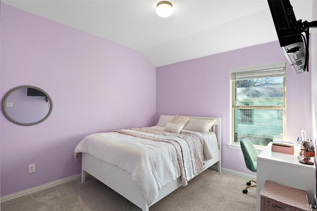 1318 Exeter Avenue Dallas, TX 75216 - Photo 11 of 31 a bedroom with a bed and a window