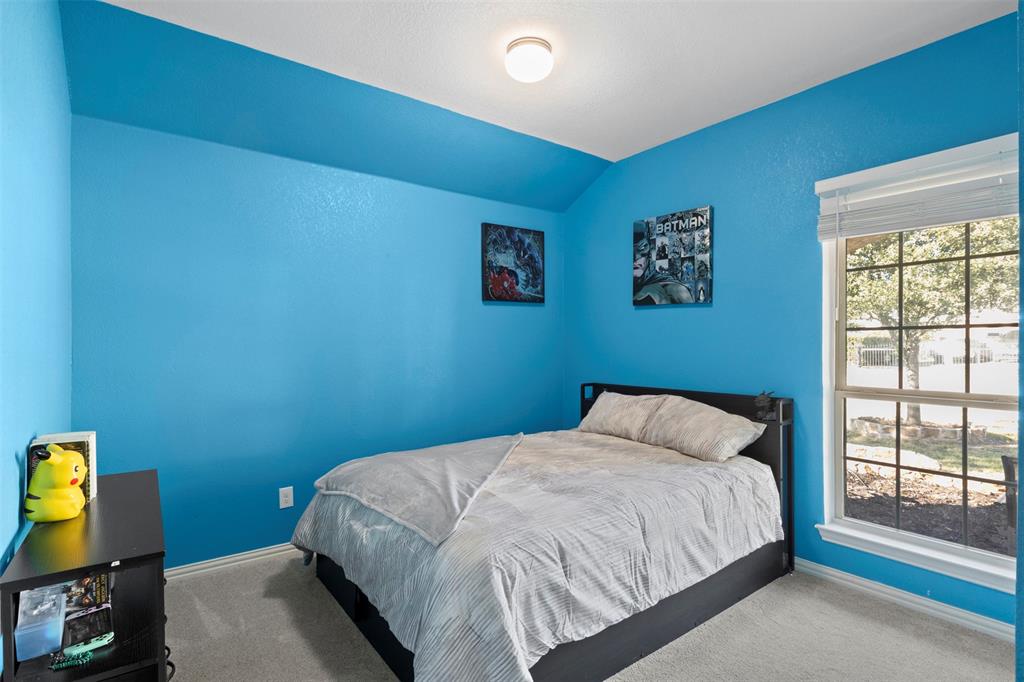 1318 Exeter Avenue Dallas, TX 75216 - Photo 14 of 31 a bedroom with a bed and a window