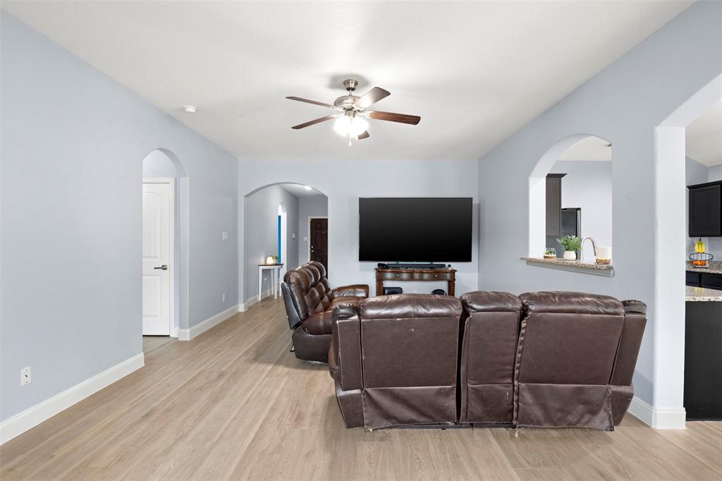 1318 Exeter Avenue Dallas, TX 75216 - Photo 21 of 31 a living room with furniture and a flat screen tv