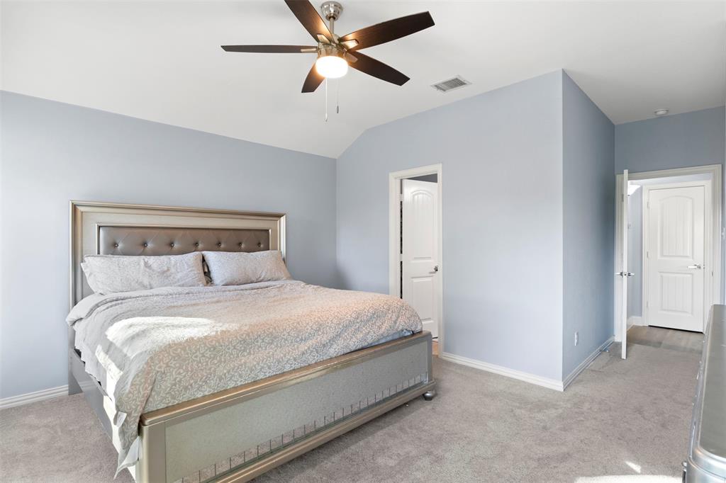 1318 Exeter Avenue Dallas, TX 75216 - Photo 25 of 31 a bedroom with a bed and a ceiling fan