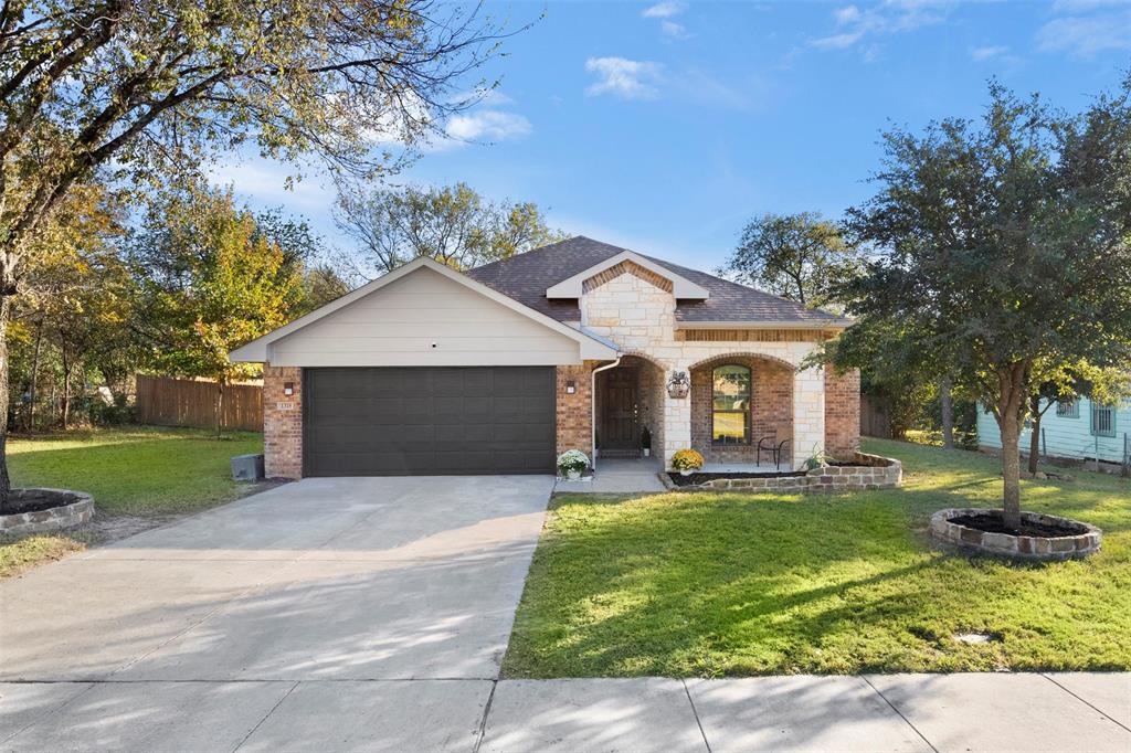 1318 Exeter Avenue Dallas, TX 75216 - Photo 28 of 31 a front view of a house with yard and green space