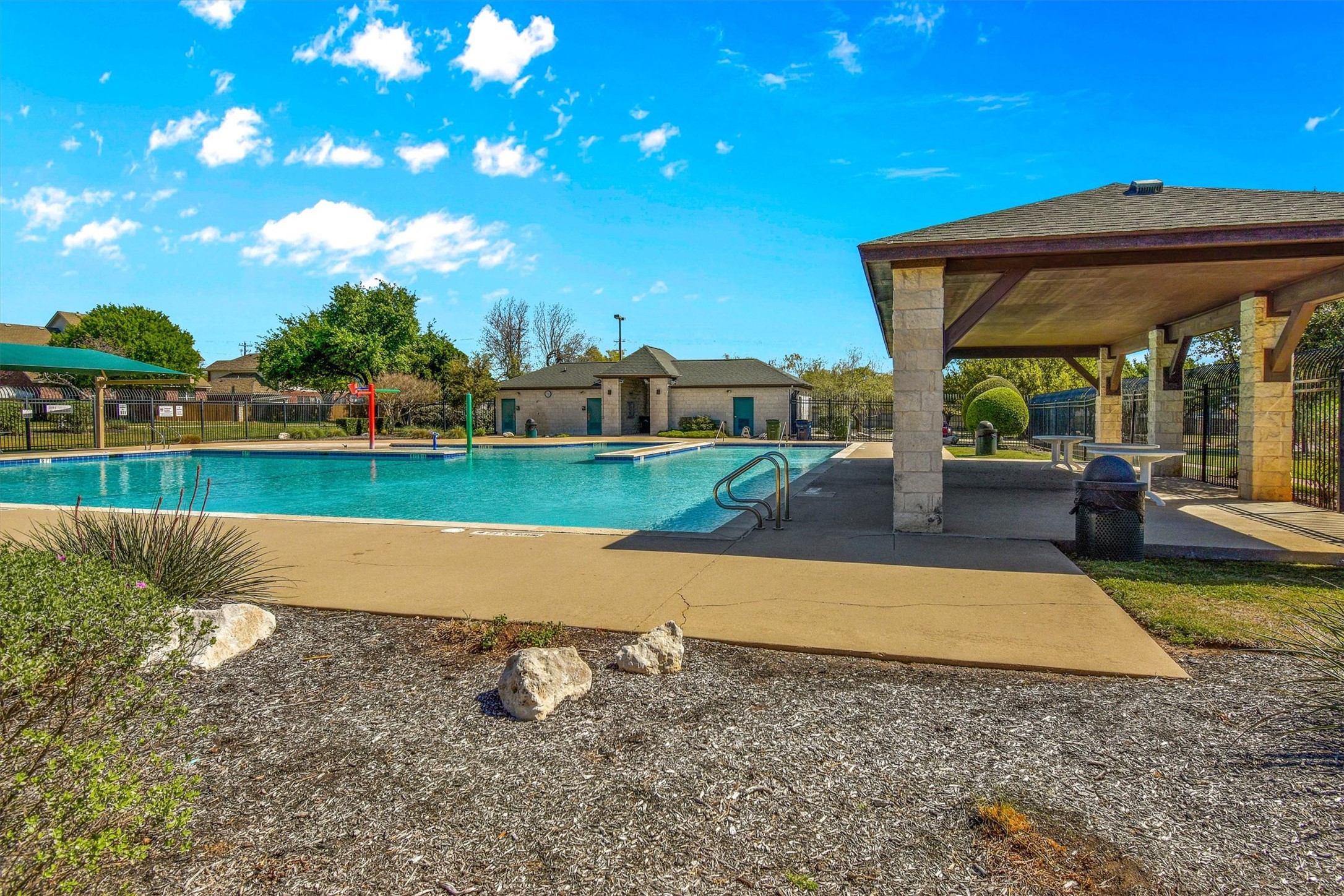 92 Verde Ranch Loop Leander, TX 78641 - Photo 31 of 37 Community pool featuring a patio and area for grilling