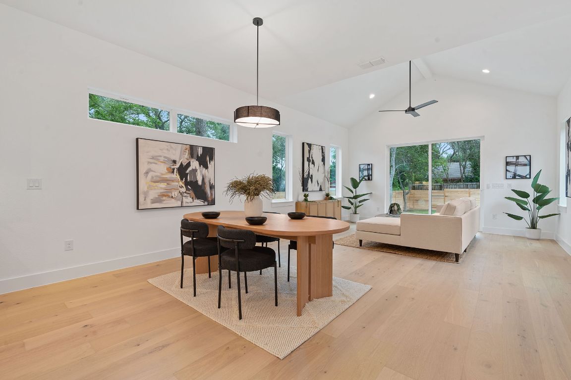 3412 Blumie Street, Unit 1 Austin, TX 78745 - Photo 14 of 39 Dining room with high vaulted ceiling, light wood-type flooring, ceiling fan, and recessed lighting