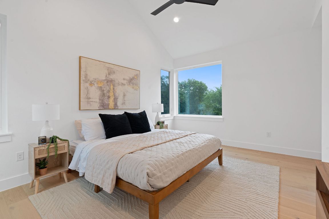 3412 Blumie Street, Unit 1 Austin, TX 78745 - Photo 16 of 39 Bedroom featuring high vaulted ceiling, light wood-type flooring, ceiling fan, and recessed lighting