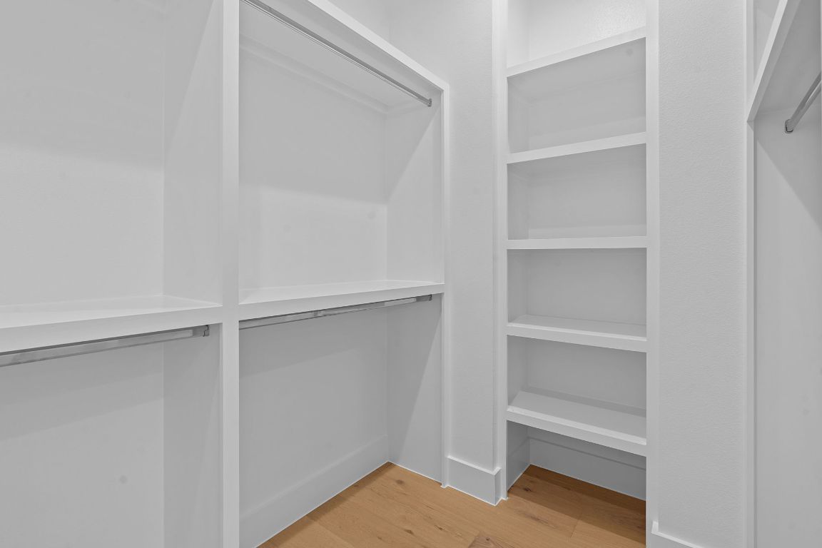 3412 Blumie Street, Unit 1 Austin, TX 78745 - Photo 22 of 39 Walk in closet with light wood-style floors