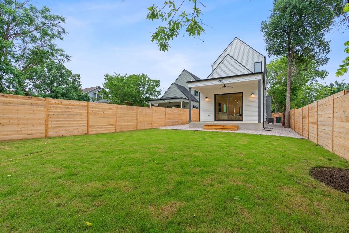 3412 Blumie Street, Unit 1 Austin, TX 78745 - Photo 31 of 39 Back of house featuring a ceiling fan, a patio, and a fenced backyard