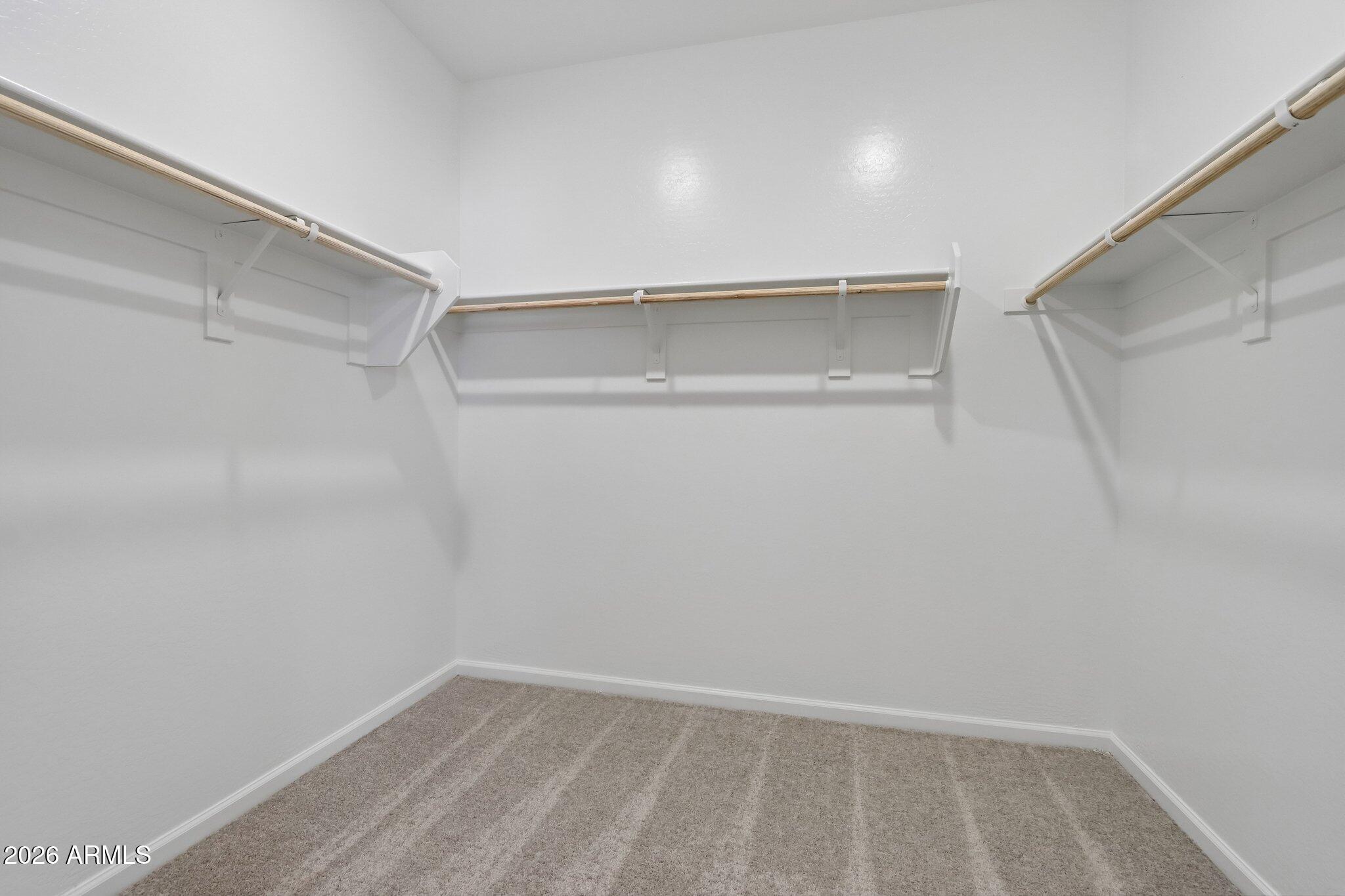9544 West Gaby Road Tolleson, AZ 85353 - Photo 17 of 43 a view of an empty walk in closet