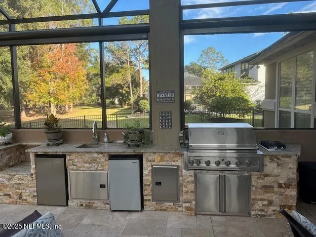 a kitchen with a stove and a sink