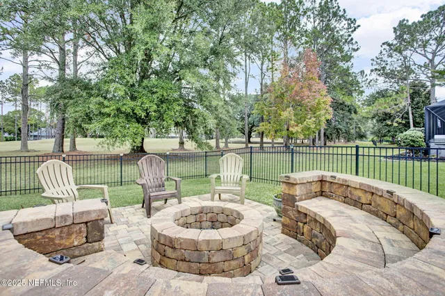 a patio with a yard table and chairs