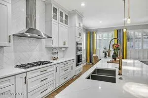 a kitchen with counter top space and stove top oven