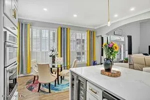 a view of a dining room with furniture window and wooden floor