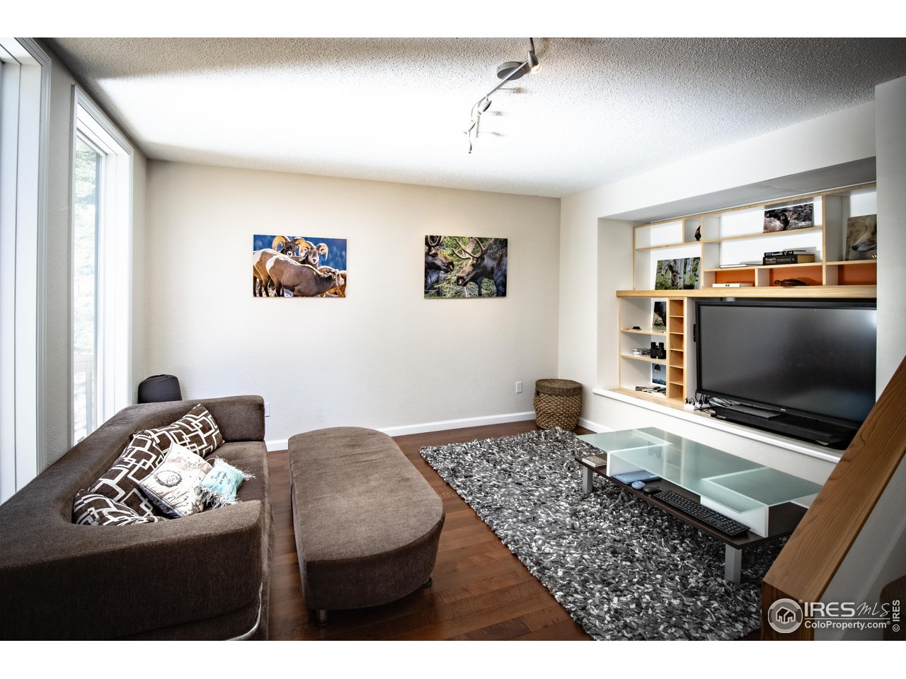 418 Ridge Road Ward, CO 80481 - Photo 15 of 36 a living room with furniture and a flat screen tv