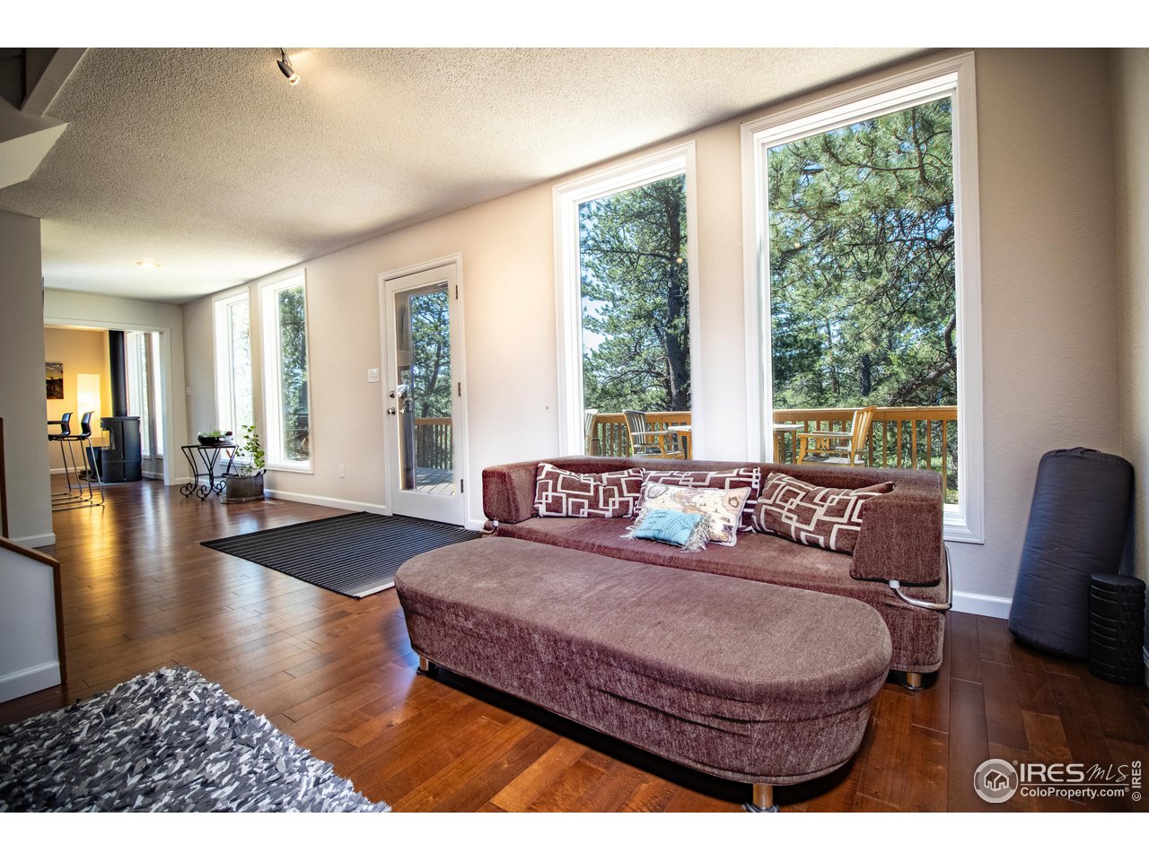 418 Ridge Road Ward, CO 80481 - Photo 16 of 36 a living room with furniture and a large window