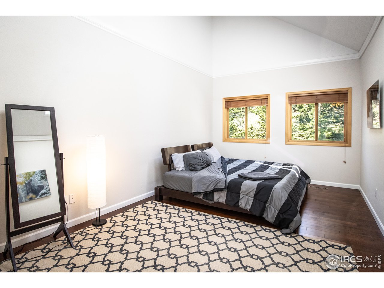 418 Ridge Road Ward, CO 80481 - Photo 20 of 36 a bedroom with a bed and a window