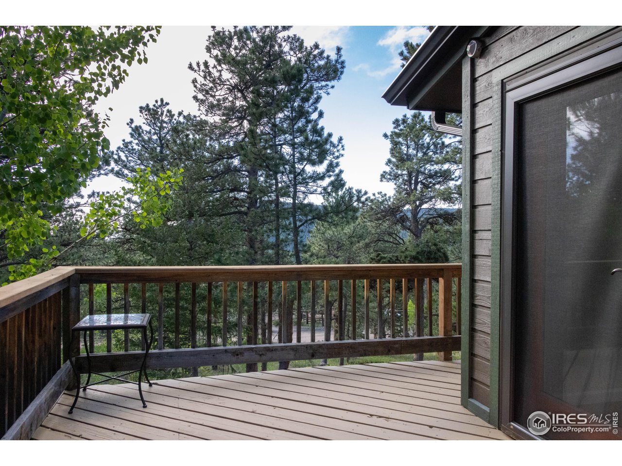 418 Ridge Road Ward, CO 80481 - Photo 5 of 36 a view of balcony with wooden floor and fence