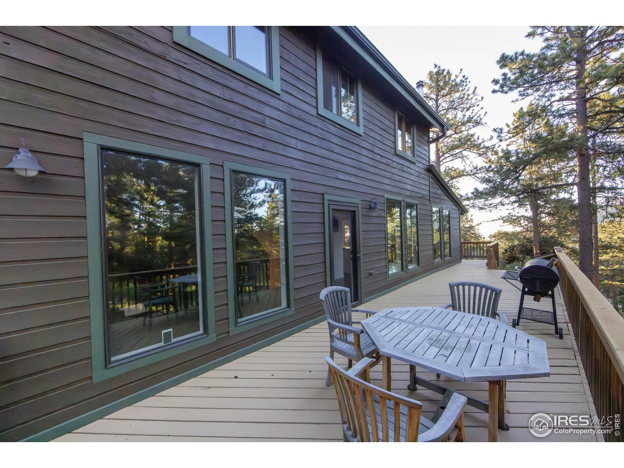418 Ridge Road Ward, CO 80481 - Photo 8 of 36 a view of backyard with a deck and wooden floor