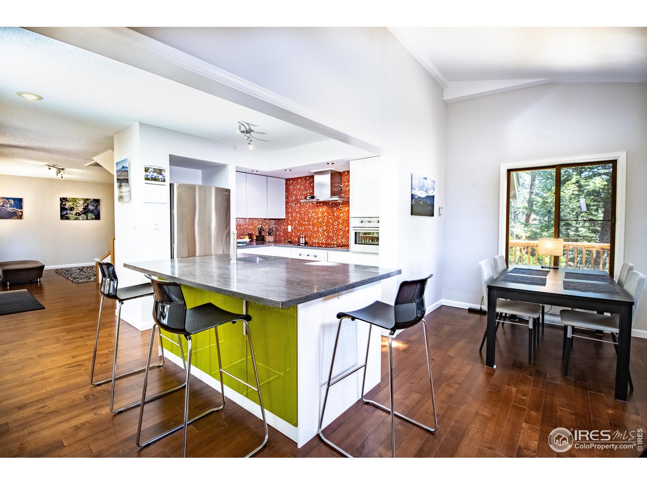 418 Ridge Road Ward, CO 80481 - Photo 10 of 36 a living room with furniture dining table and wooden floor