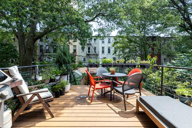 a kitchen with stainless steel appliances granite countertop a sink and a stove