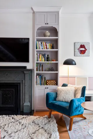 a living room with furniture fireplace and flat screen tv