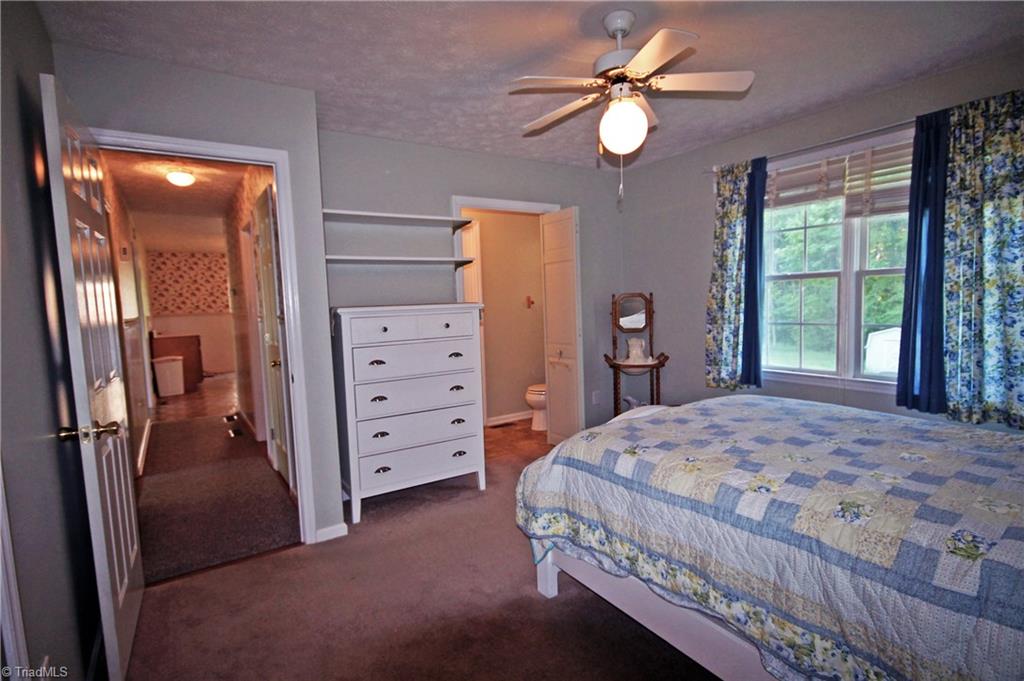 1155 Capella Ridge Road King, NC 27021 - Photo 17 of 21 Master bedroom/hallway to kitchen/half bath with access to full bath