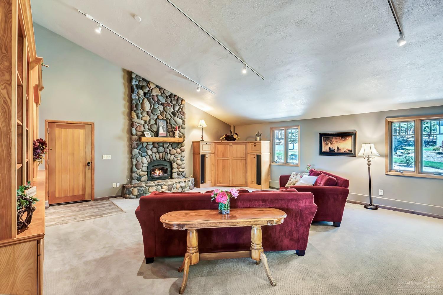 69652 Camp Polk Road Sisters, OR 97759 - Photo 13 of 25 Family room with 2nd river rock fireplac