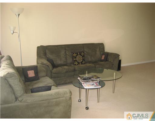 1207 Timber Oaks Road Edison, NJ 08820 - Photo 3 of 10 a living room with furniture and a couch