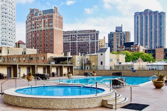 655 West Irving Park Road, Unit 2509 Chicago, IL 60613 - Photo 13 of 20 a swimming pool view with a outdoor seating
