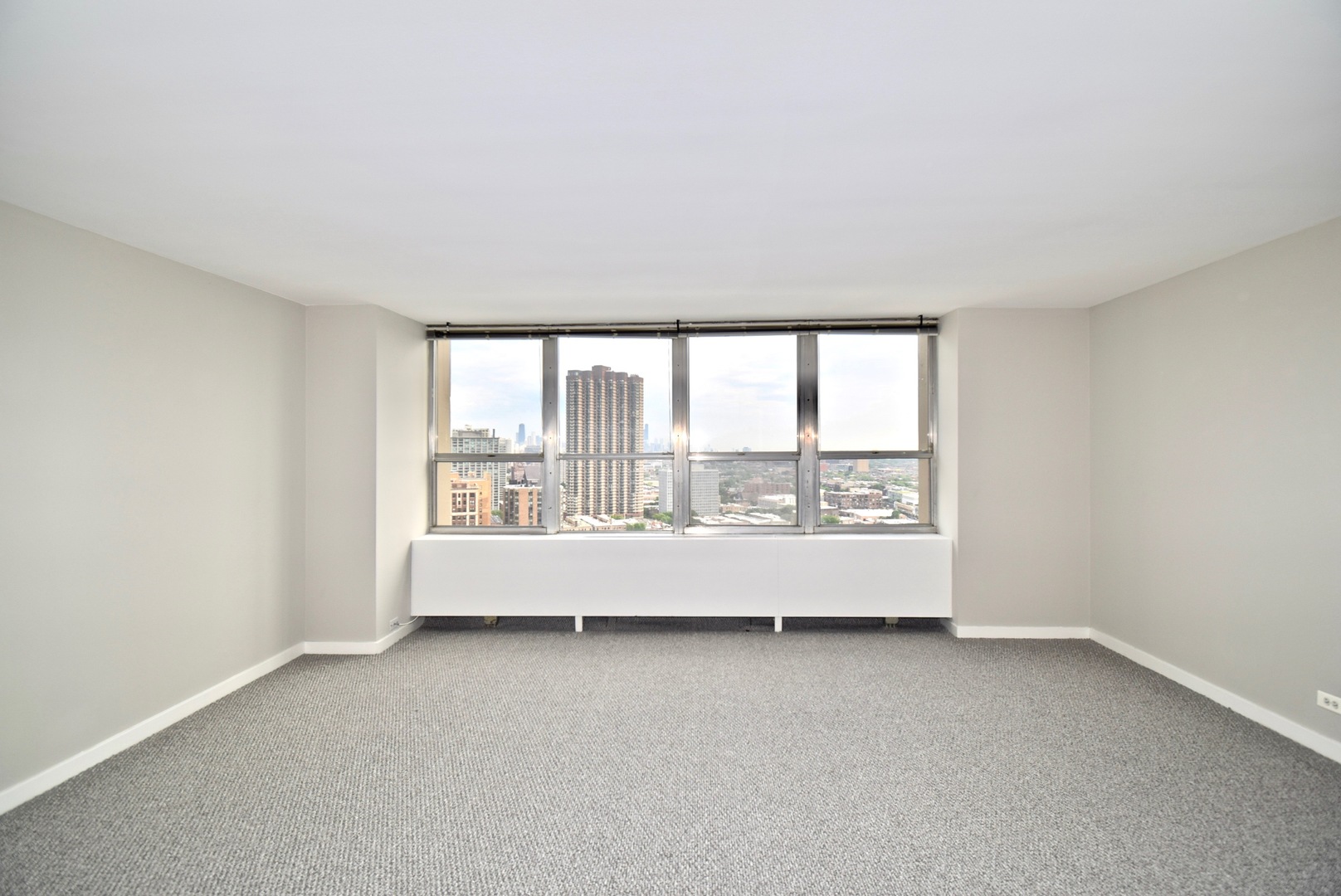 655 West Irving Park Road, Unit 2509 Chicago, IL 60613 - Photo 5 of 20 an empty room with a large window