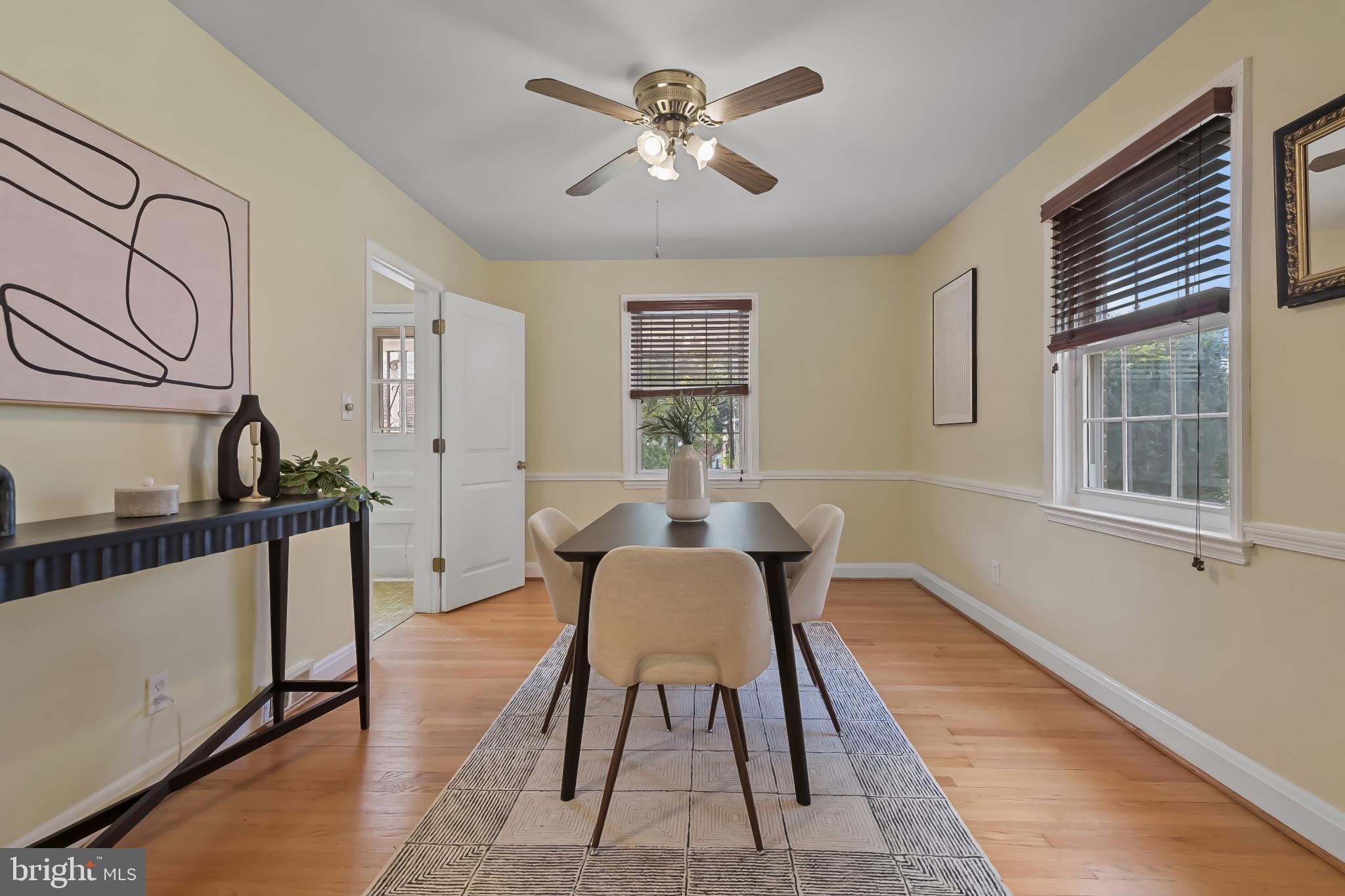 101 Regester Avenue Baltimore, MD 21212 - Photo 21 of 53 a view of a dining room with furniture a rug and wooden floor
