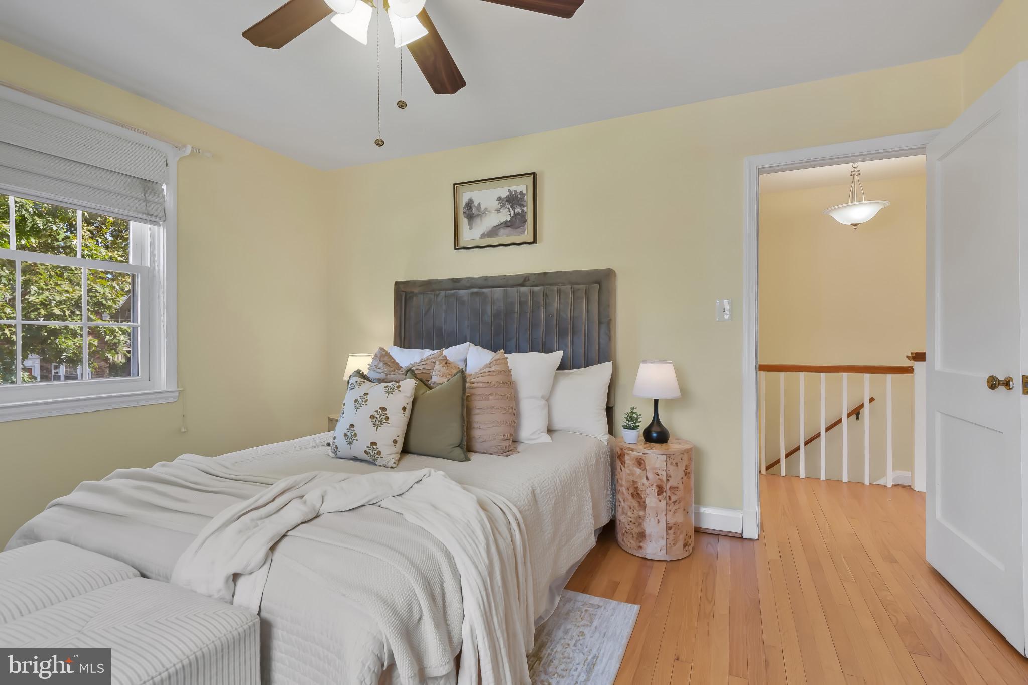 101 Regester Avenue Baltimore, MD 21212 - Photo 32 of 53 a bedroom with a large bed and a chandelier