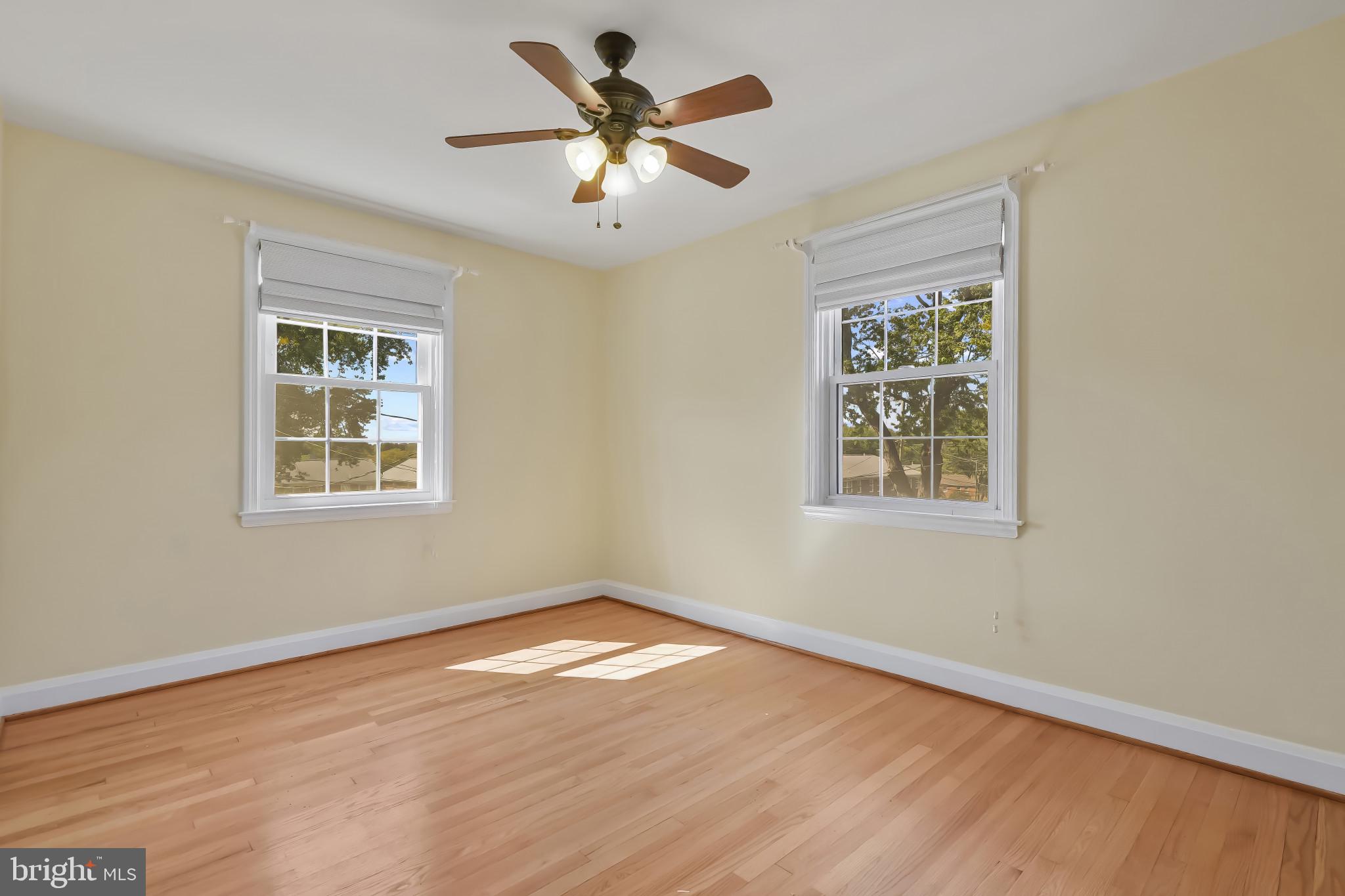 101 Regester Avenue Baltimore, MD 21212 - Photo 36 of 53 a view of an empty room with wooden floor and a window