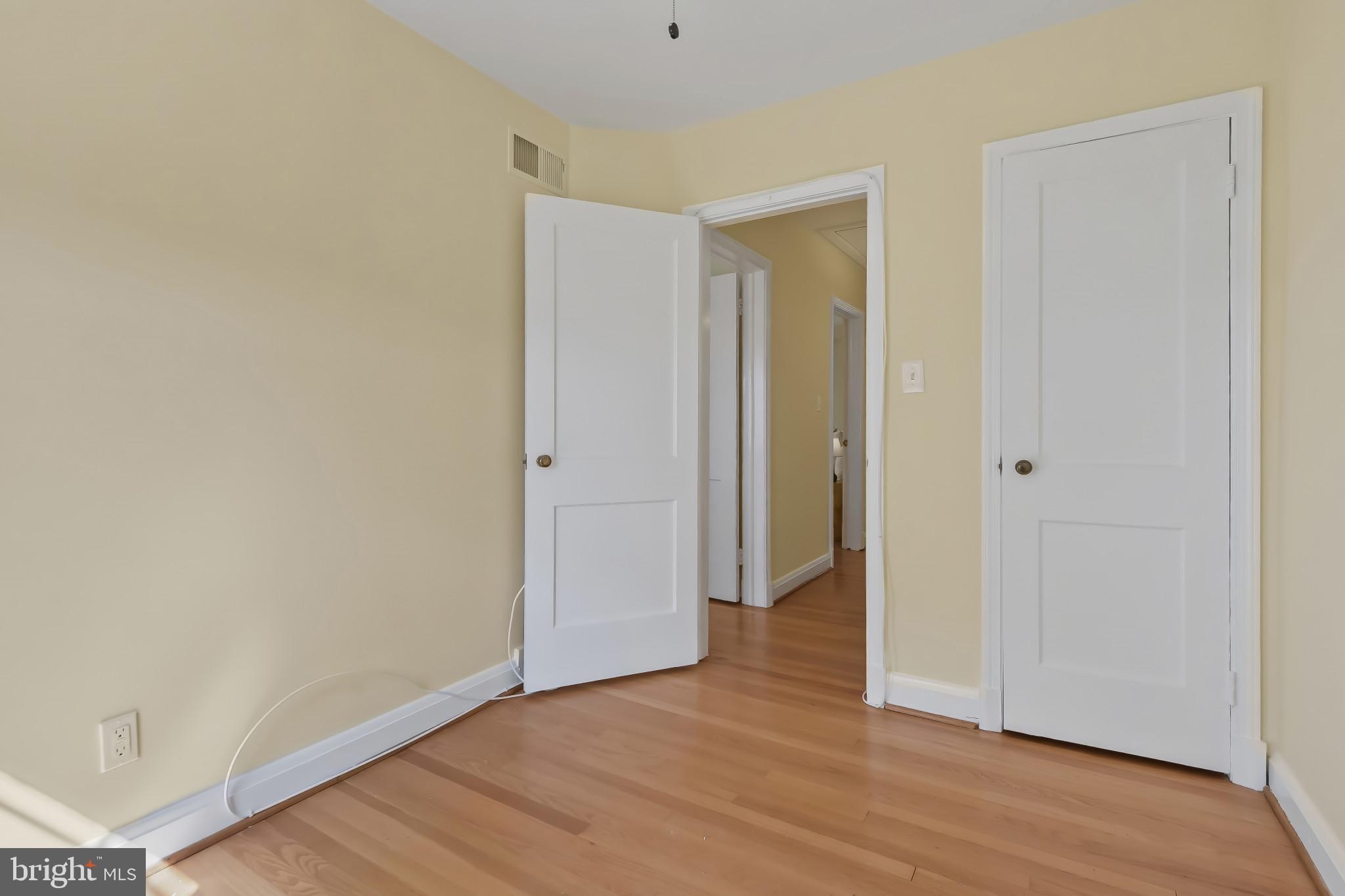 101 Regester Avenue Baltimore, MD 21212 - Photo 43 of 53 a view of an empty room with wooden floor