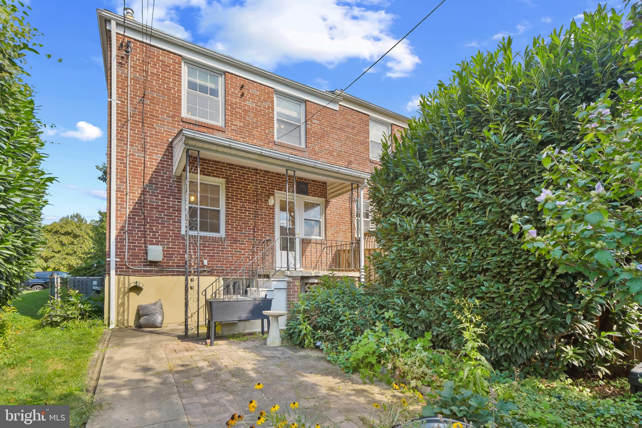 101 Regester Avenue Baltimore, MD 21212 - Photo 48 of 53 a front view of a house with a garden