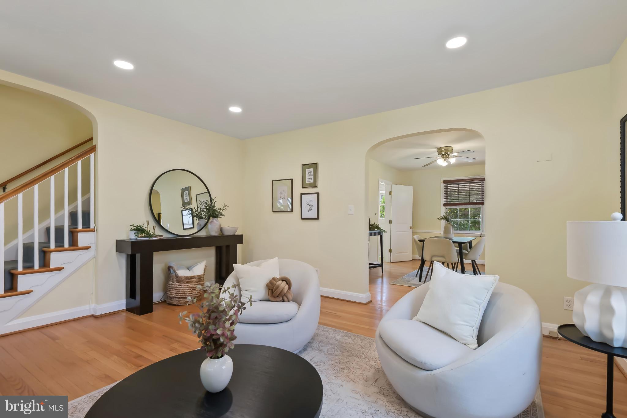 101 Regester Avenue Baltimore, MD 21212 - Photo 7 of 53 a living room with furniture a fireplace and a large mirror