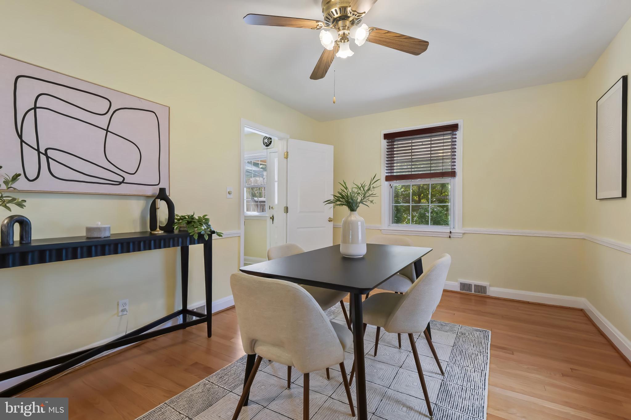 101 Regester Avenue Baltimore, MD 21212 - Photo 9 of 53 a view of a dining room with furniture and wooden floor
