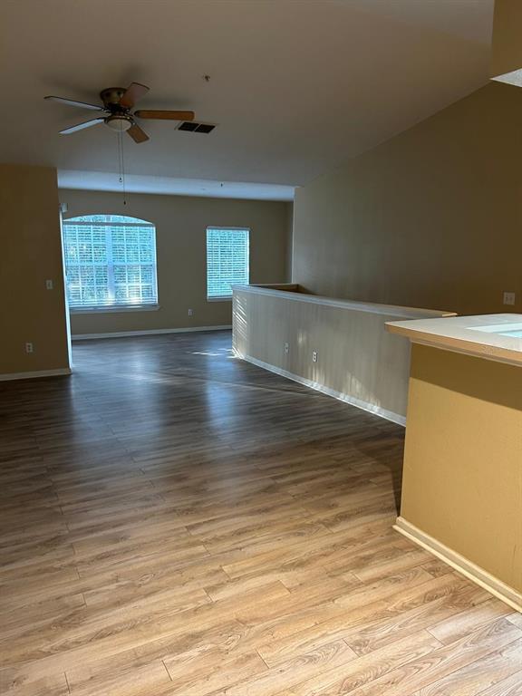 4320 South Kirkman Road, Unit 1510 Orlando, FL 32811 - Photo 4 of 10 a view of empty room with wooden floor