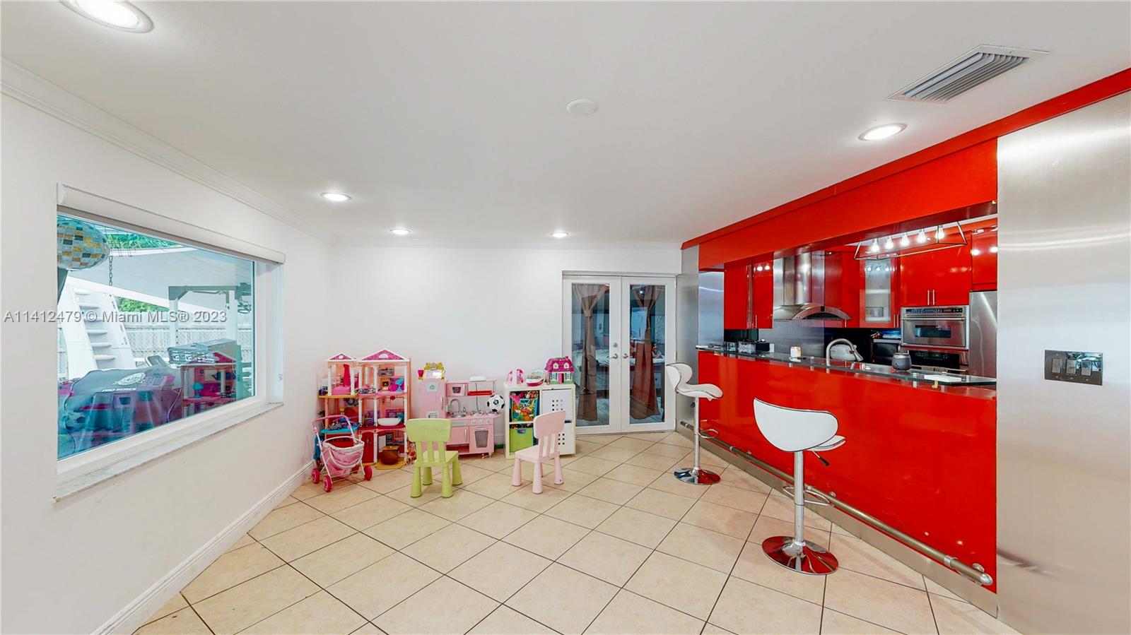 13821 Southwest 14th Street Miami, FL 33184 - Photo 17 of 58 a very nice looking room with a large window