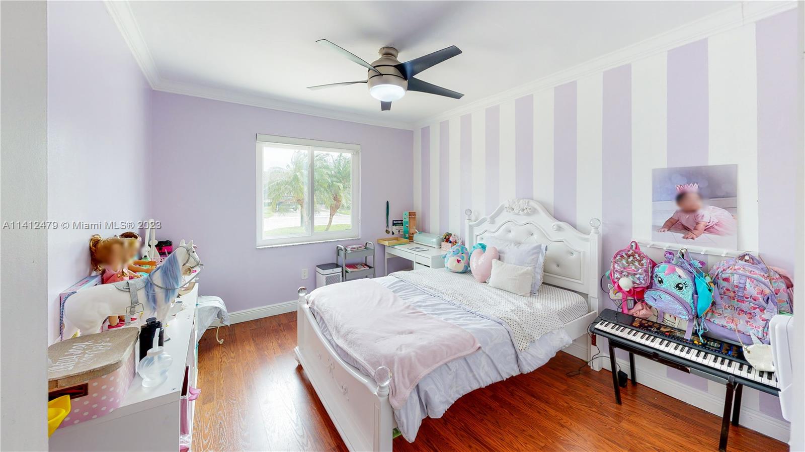 13821 Southwest 14th Street Miami, FL 33184 - Photo 22 of 58 a bedroom with a bed and a window